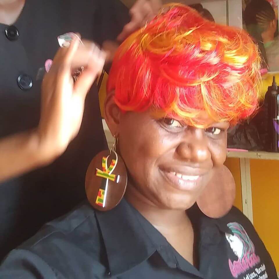 Camaria Beauty School. Student testing a hairstyle.